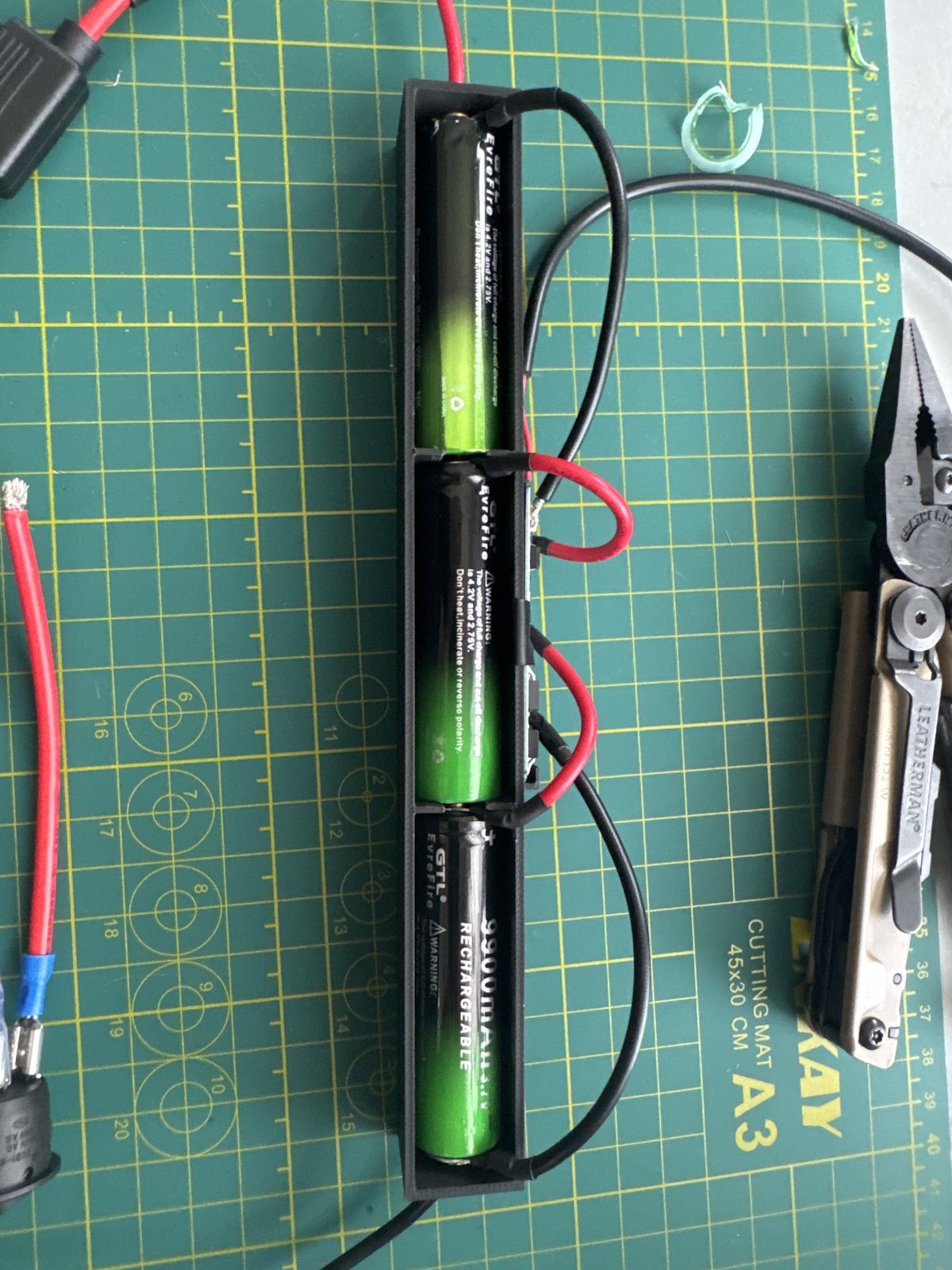 Three 18650 Li-ion cells in series inside the custom 3D-printed battery housing